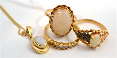 Lot 15 - A 9ct gold diamond half hoop ring, an opal ring stamped '10k', a 9ct gold opal ring and an opal...