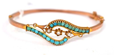 Lot 19 - A turquoise and seed pearl set bangle