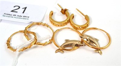 Lot 21 - A pair of 18ct gold Greek key design cuff earrings and two pairs of hoop earrings, stamped '750'