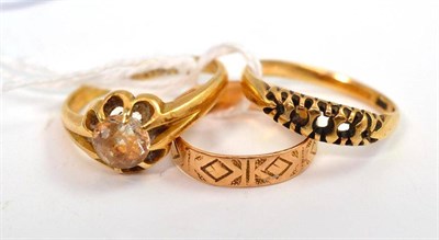 Lot 27 - An 18ct gold stone set ring, an 18ct gold patterned band ring and a ring stamped '18CT',...