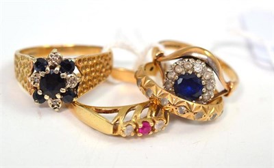 Lot 36 - A 9ct gold sapphire and diamond ring and three stone set rings (4)