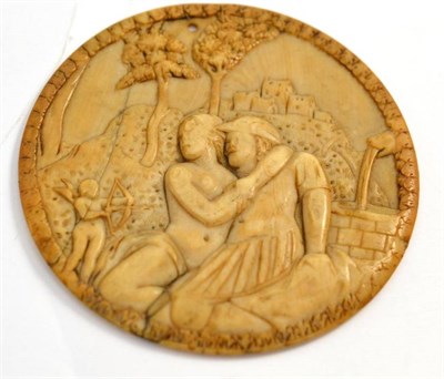 Lot 49 - A 17th/18th century carved ivory disc