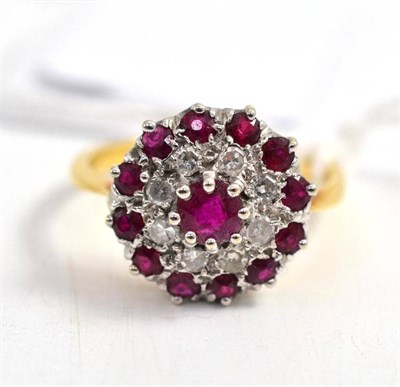 Lot 54 - An 18ct gold ruby and diamond cluster ring