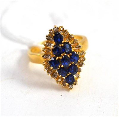 Lot 55 - An 18ct gold sapphire and diamond cluster ring