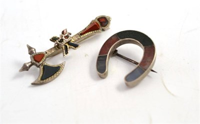 Lot 57 - A horseshoe brooch set with agates and an axe brooch