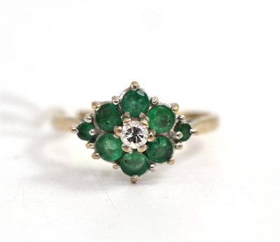 Lot 58 - Diamond and emerald cluster ring, stamped '18CT'