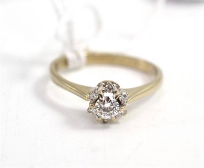 Lot 59 - A diamond cluster ring, a round brilliant cut diamond centrally within a border of single cut...