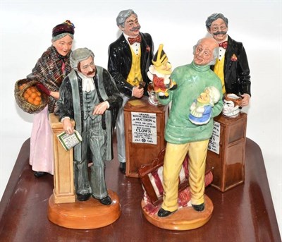 Lot 70 - Royal Doulton - Auctioneer (x2), Punch and Judy Man, The Lawyer, Orange Lady (5)