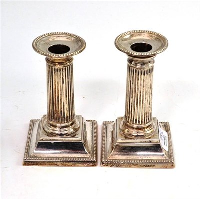 Lot 94 - Pair of silver squat candlesticks