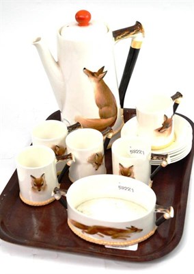 Lot 97 - A Royal Doulton 'Reynard the Fox' coffee set, comprising coffee pot and cover, five cups and...