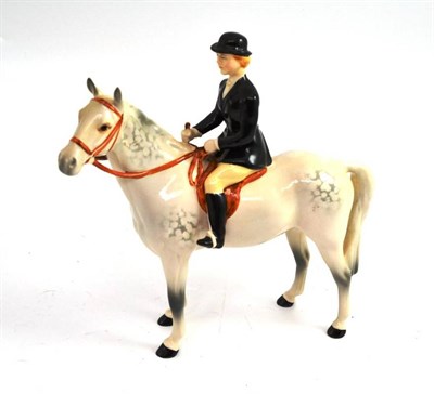 Lot 139 - A Beswick huntswoman on grey horse