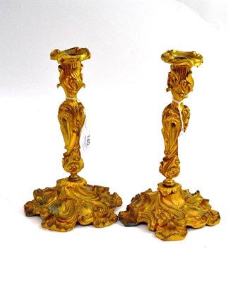 Lot 140 - A pair of ormolu candlesticks