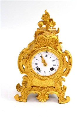 Lot 141 - A 19th century French gilt metal rococo scrolling mantel clock with white enamel dial and blue...