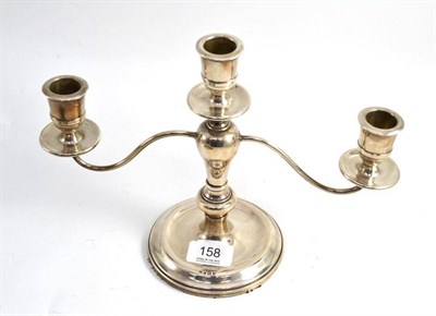 Lot 158 - A silver three branch candelabrum