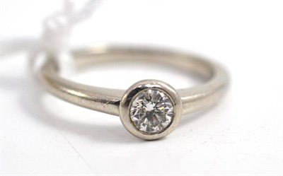 Lot 181 - A platinum diamond solitaire ring, by Dower and Hall, the round brilliant cut diamond in a...