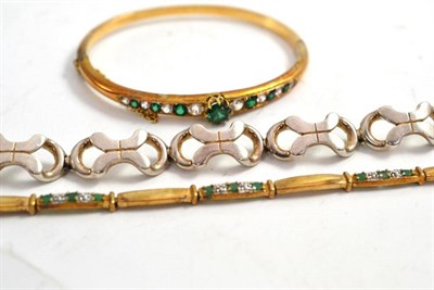 Lot 207 - Gilt bangle, gem set and two others