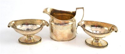 Lot 276 - A pair of Georgian silver salts and a silver milk jug (3)