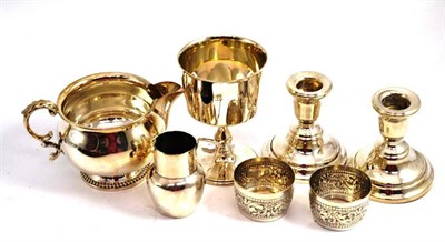 Lot 299 - Silver jug, a chalice, pair of candlesticks, two beakers and a jug (7)