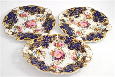 Lot 311 - Three 19th century porcelain dessert plates, painted with floral sprays, gilt and blue ground