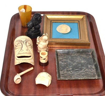 Lot 317 - 19th century carved ivory mask, soap stone dish, carved ivory portrait disc, horn beaker etc