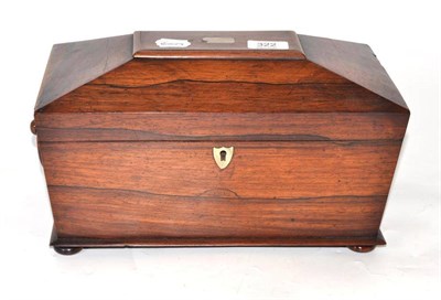 Lot 322 - A George IV rosewood tea caddy of sarcophagus form and two Georgian silver caddy spoons