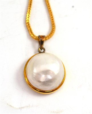 Lot 357 - A mabé pearl pendant on chain