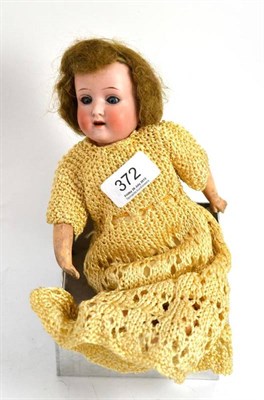 Lot 372 - A Simon & Halbig bisque socket head small doll with composition jointed body