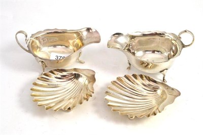 Lot 378 - A pair of Victorian silver shell dishes and two silver sauce boats