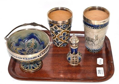 Lot 398 - Four pieces of Royal Doulton stoneware including a sugar bowl with silver mounts, by Hukin and...