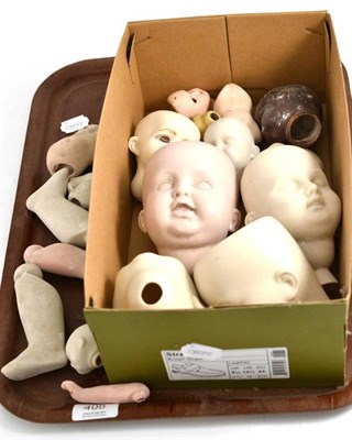 Lot 408 - Tray including assorted dolls heads and body parts