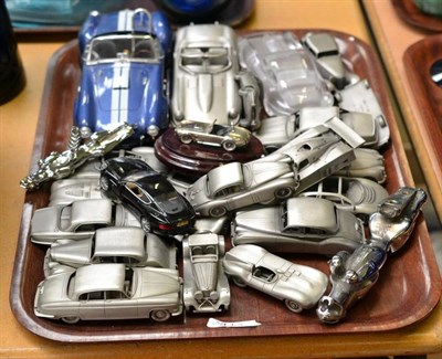 Lot 413 - A tray of mainly modern pewter Jaguar car models, a chrome car mascot, corkscrew, assorted car...