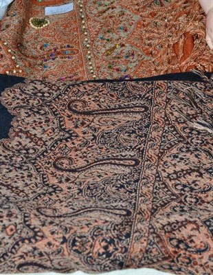 Lot 427 - Jacquard type rust ground shawl with bead and sequin decoration and a Paisley type shawl with black