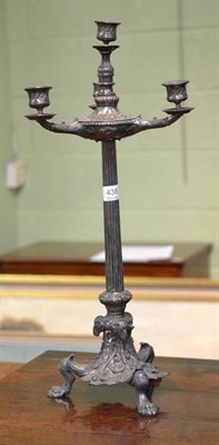 Lot 438 - A 19th century silver plated three branch candelabra with paw feet and column stem (two nozzles...