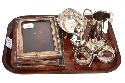 Lot 441 - Silver napkin rings, silver pepperette, silver photograph frames, silver jug and a silver dish