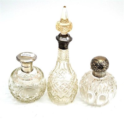 Lot 442 - Two silver topped scent bottles and another (3)