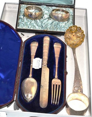 Lot 463 - A Victorian silver three piece christening set, sifter spoon and three napkins