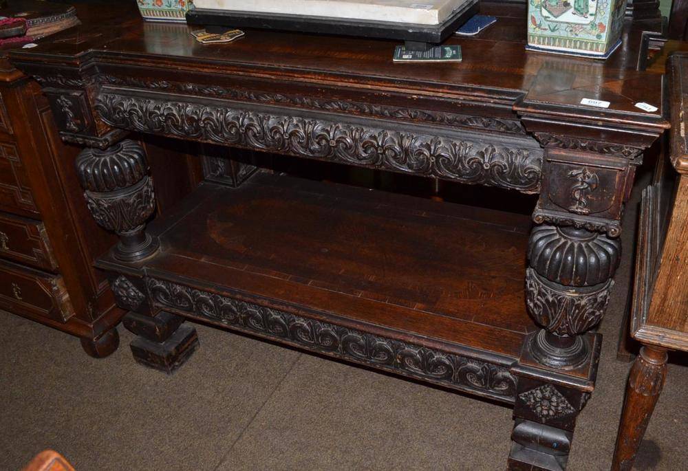 Lot 697 - A 19th century carved oak buffet serving table, width 124cm