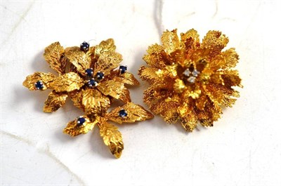 Lot 24 - An 18ct gold diamond set floral brooch and a 9ct gold sapphire set floral brooch