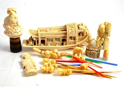 Lot 29 - Quantity of small ivory items including a Chinese barge, dog figure, cocktail sticks, figures etc