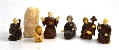 Lot 30 - Five hardwood and ivory figures and two other figures