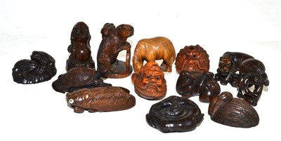 Lot 32 - Thirteen carved hardwood netsukes