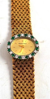 Lot 45 - A 9ct gold lady's wristwatch by Bueche Girod, set with emeralds and diamonds