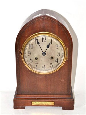 Lot 67 - An Edwardian lancet cased mantel clock with silvered dial