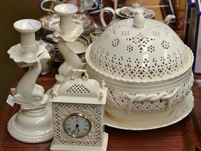 Lot 69 - Creamware tureen cover and stand, pair of dolphin candlesticks and a mantel clock