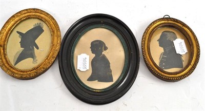 Lot 112 - Two Georgian miniature silhouette portraits in gilt brass frames and a silhouette portrait of a...