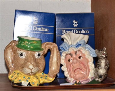 Lot 118 - Four Royal Doulton character jugs, 'The Cook and the Cheshire Cat' D6842, 'The March Hare'...