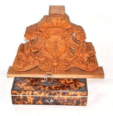 Lot 174 - A faux tortoiseshell glove box with steel mounts and a carved wood Green Man