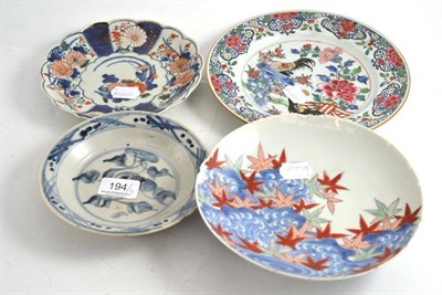 Lot 194 - A Chinese famille rose plate (a.f.), a Nabeshima type dish, an Imari dish and a Provincial...