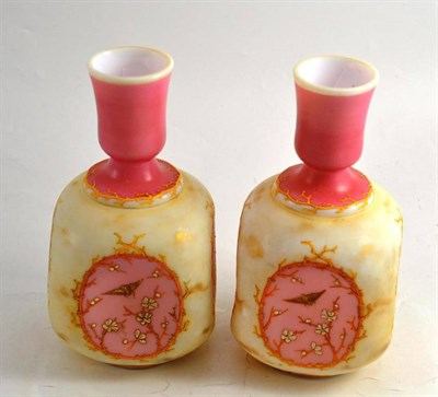 Lot 216 - A pair of pink and cream enamelled glass vases in aesthetic style