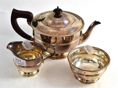 Lot 231 - A silver three piece tea service